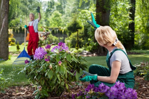 Garden maintenance team using PPE while working